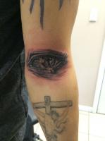 Eye and Cross Tattoo