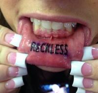 Reckless Tattoo on Inner Lip
